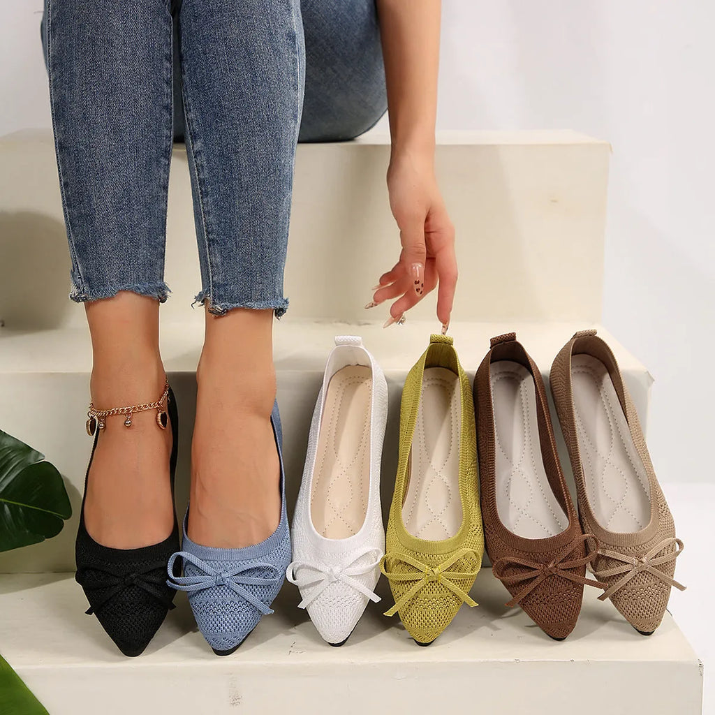 Women's knitted bow loafers with pointed-toe design in multiple colour options showing flat heel and rubber sole