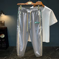 A pair of men's grey ice silk harem pants with a loose, casual fit and mid-waist design.