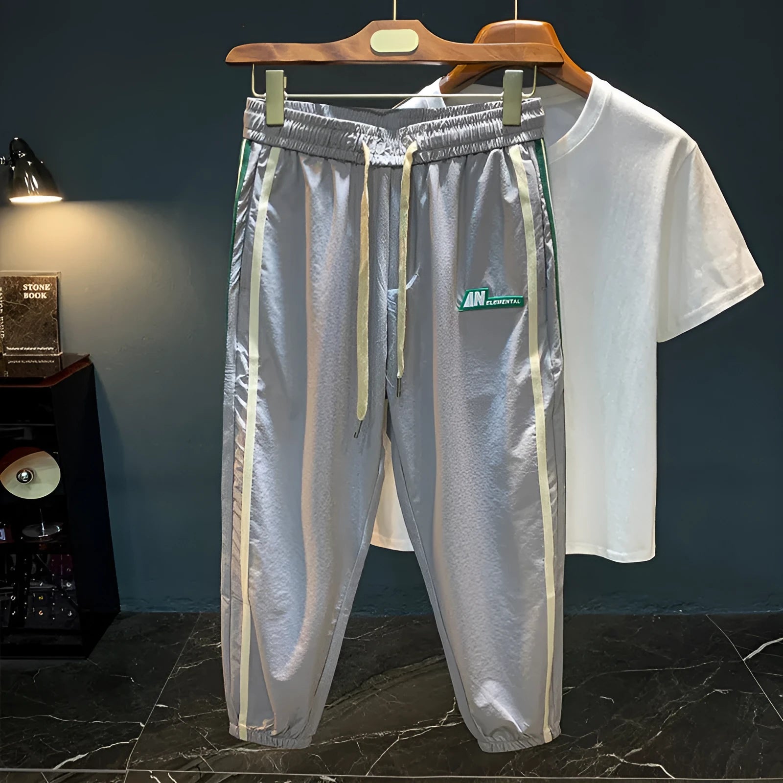 A pair of men's grey ice silk harem pants with a loose, casual fit and mid-waist design.
