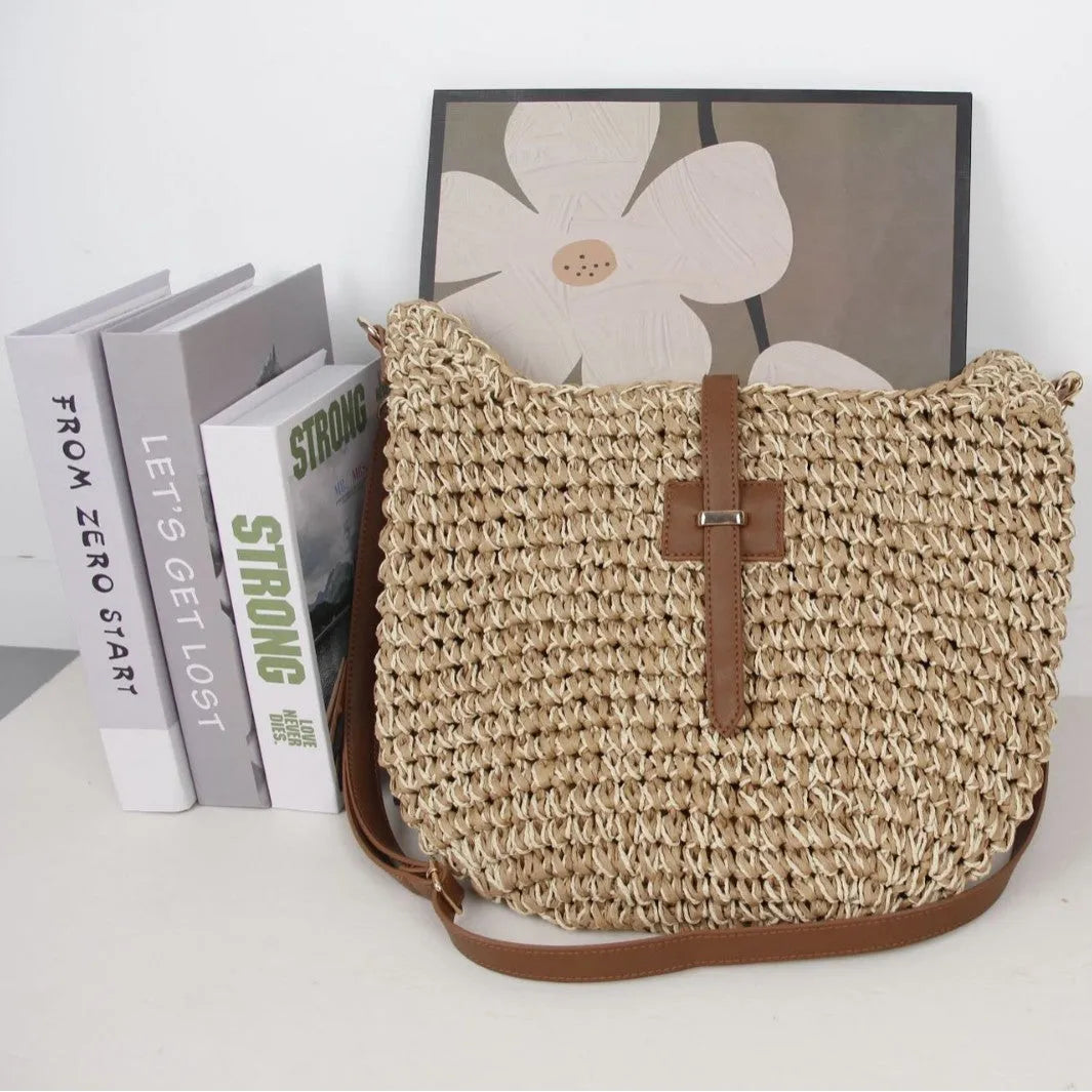 Handmade beige woven shoulder bag with decorative sewing thread details and sandwich pocket