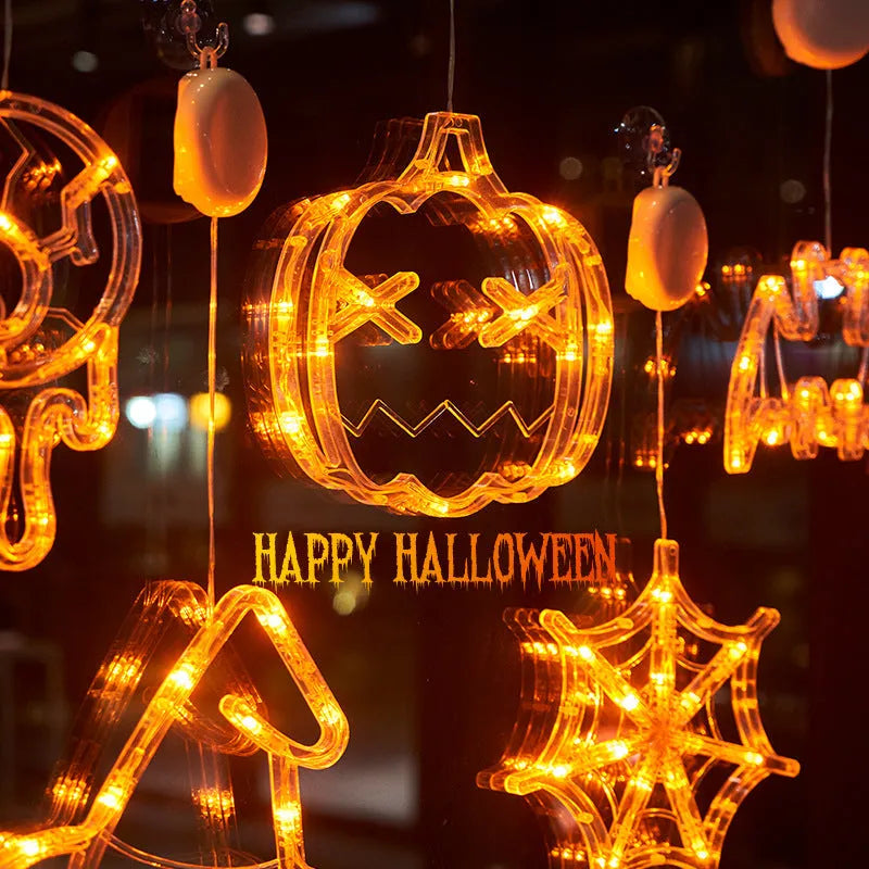 Halloween LED window lights set with spider, pumpkin and ghost designs on suction cups