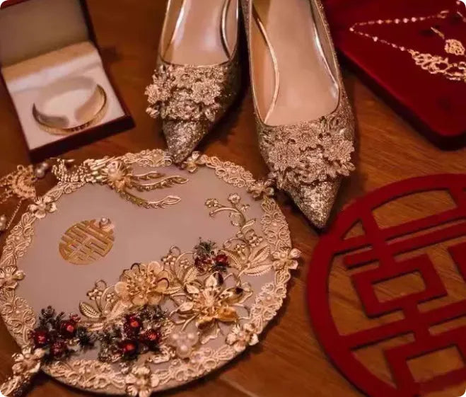 Champagne Xiuhe wedding shoes with rhinestone flower pattern and pointed toe on a fine heel.