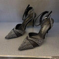 Women's hollow high heels with stiletto heel, pointed toe, and red sole in silver and black colours