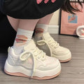 Women's green and pink artificial PU platform sneaker with front lace-up and round toe.