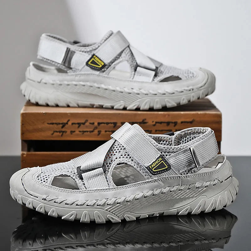 Men's casual sandals with hollow mesh surface and genuine leather upper in grey colour