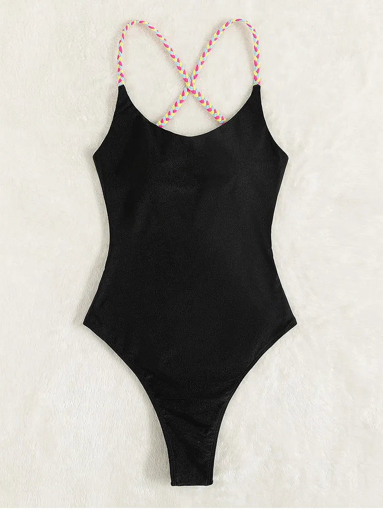 Black solid colour one-piece swimsuit with backless and sleeveless design.