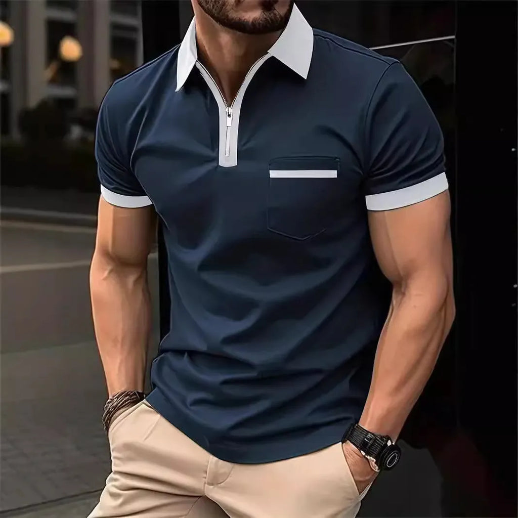 Man wearing a loose-fit short-sleeve casual shirt with a chest pocket and zipper decorations on the front.