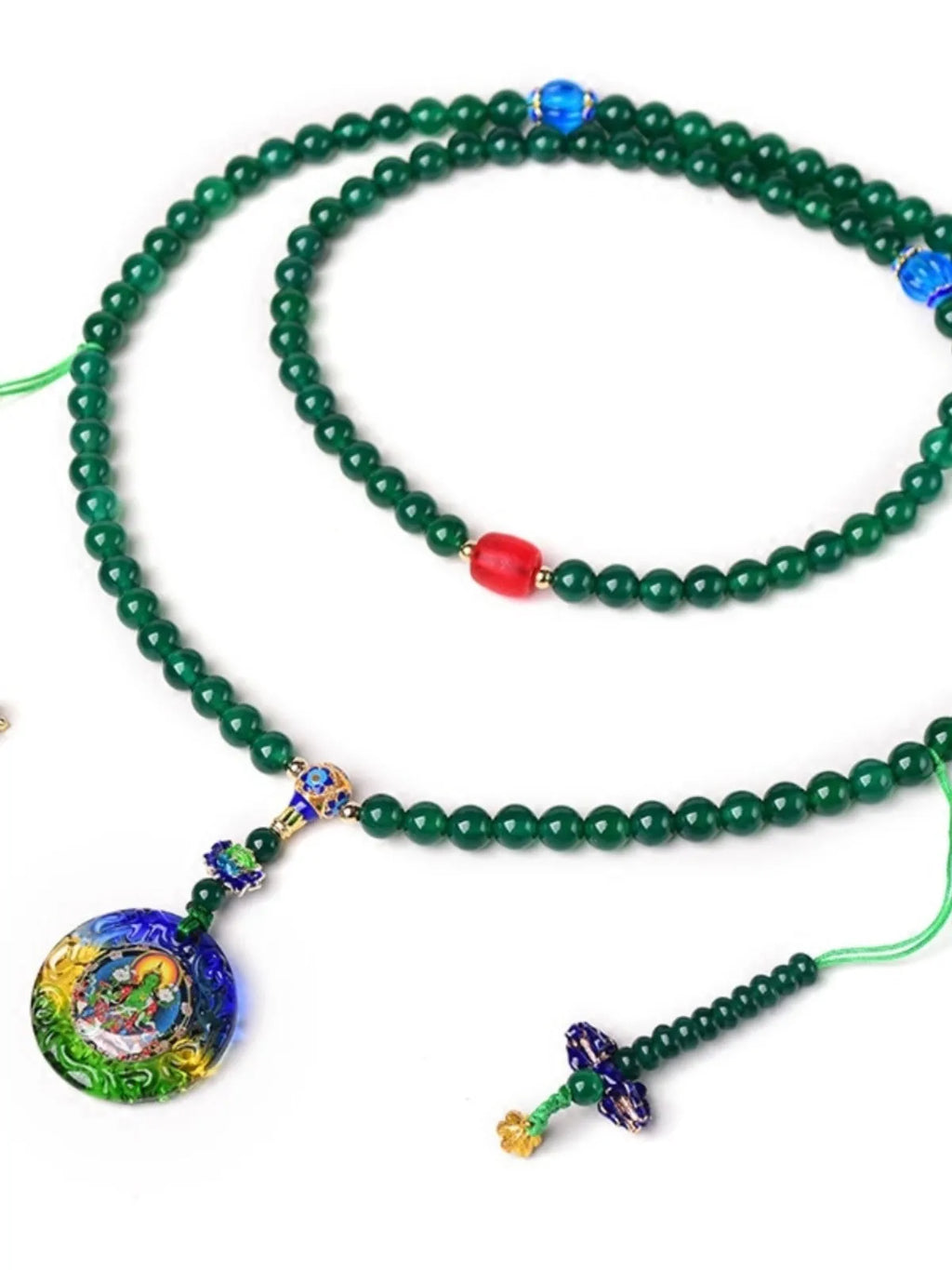 Green agate beaded bracelet with a multi-circle 108-bead thangka pendant on a wrist.