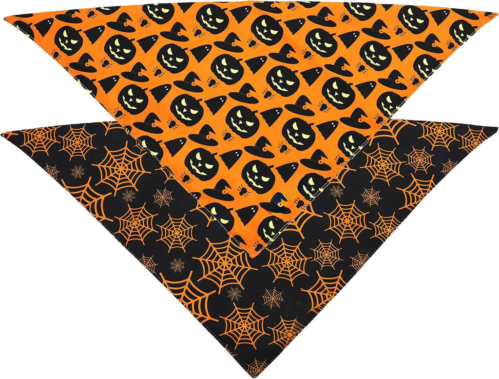 Black and orange reversible Halloween dog bandana with pumpkin and spider web patterns, shown on a dog's neck.
