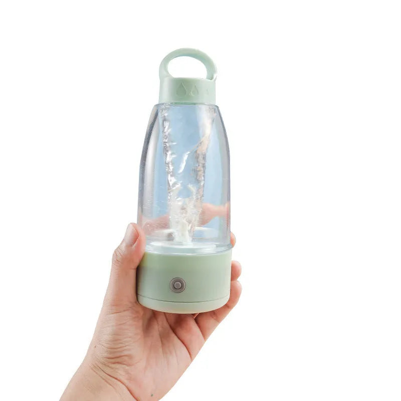 Automatic electric shaker bottle in green, pink, or white with USB port and handle for blending smoothies