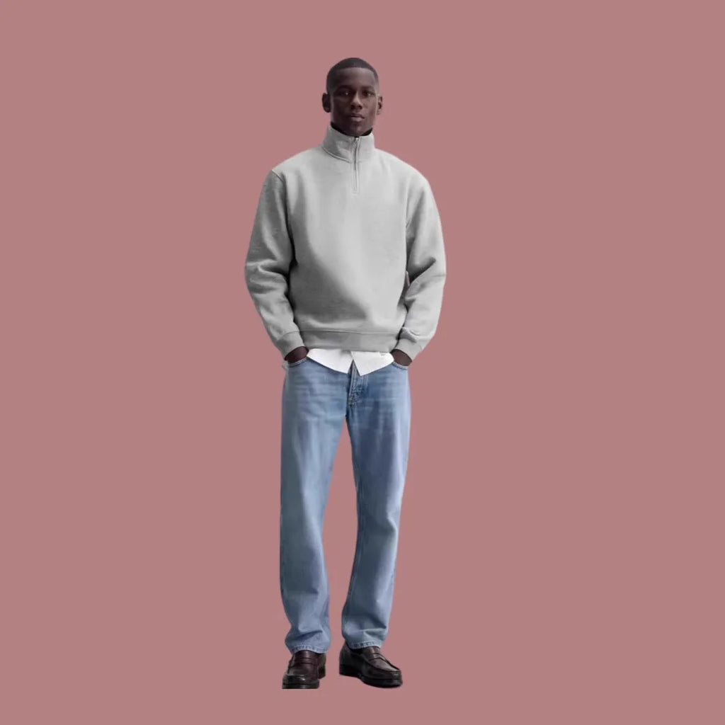 Half-zipped grey cotton sweatshirt with stand collar, long sleeves, and casual grunge style texture