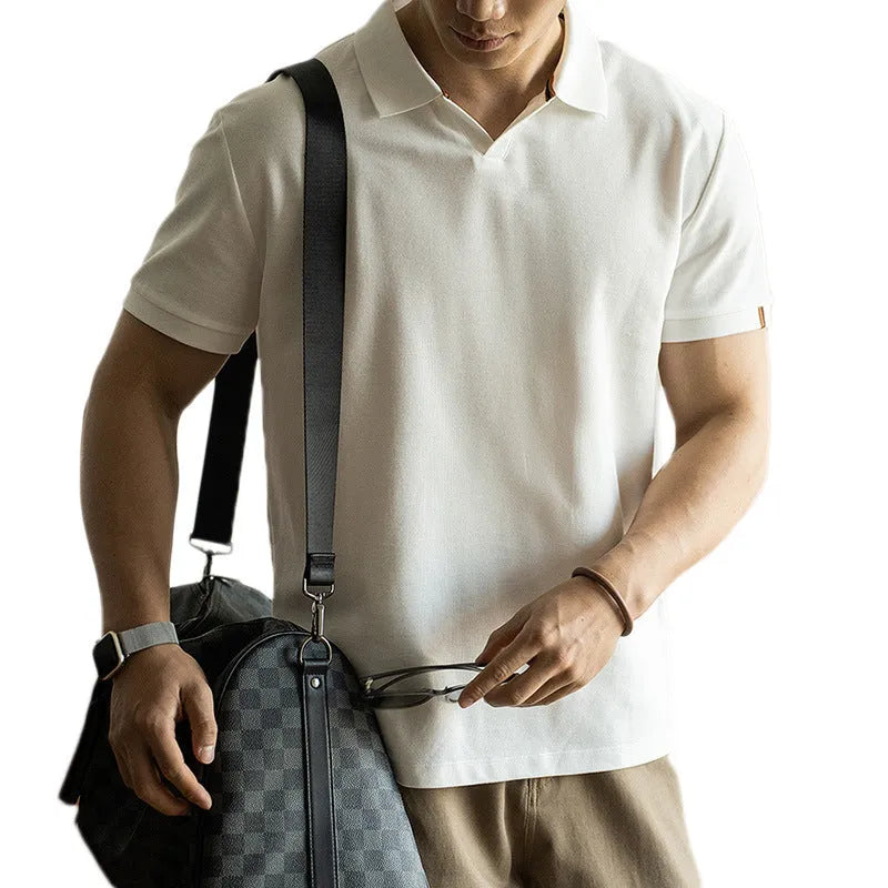 Men's blue short sleeve cotton polo shirt on a hanger, regular fit.