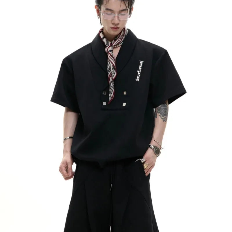 Men's dark grey V-neck sports suit with padded shoulders and metal embellishments on cotton fabric