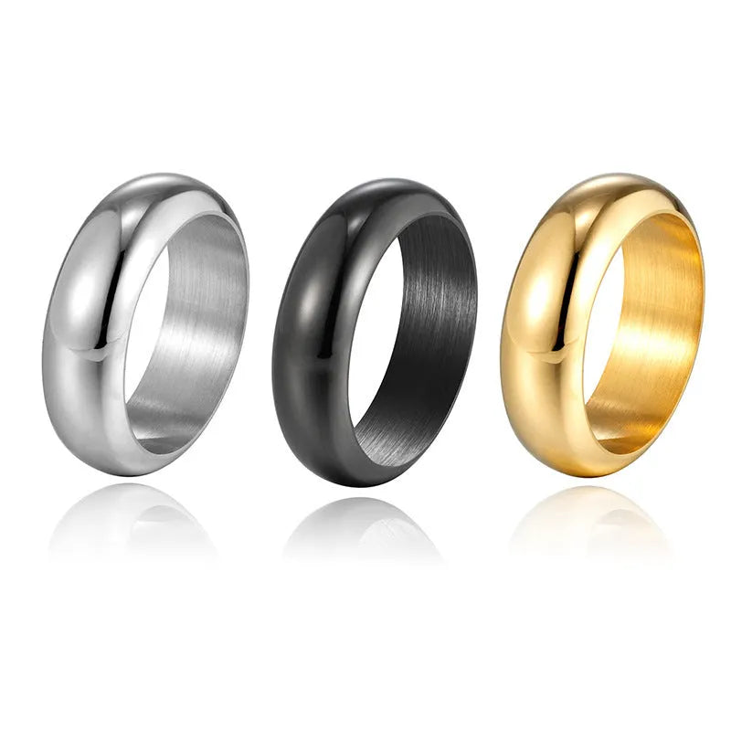 Glossy electroplated titanium steel ring in gold, black, and steel colour options on a grey background