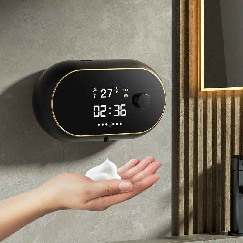 White automatic foam soap dispenser mounted on wall with hand activating infrared sensor