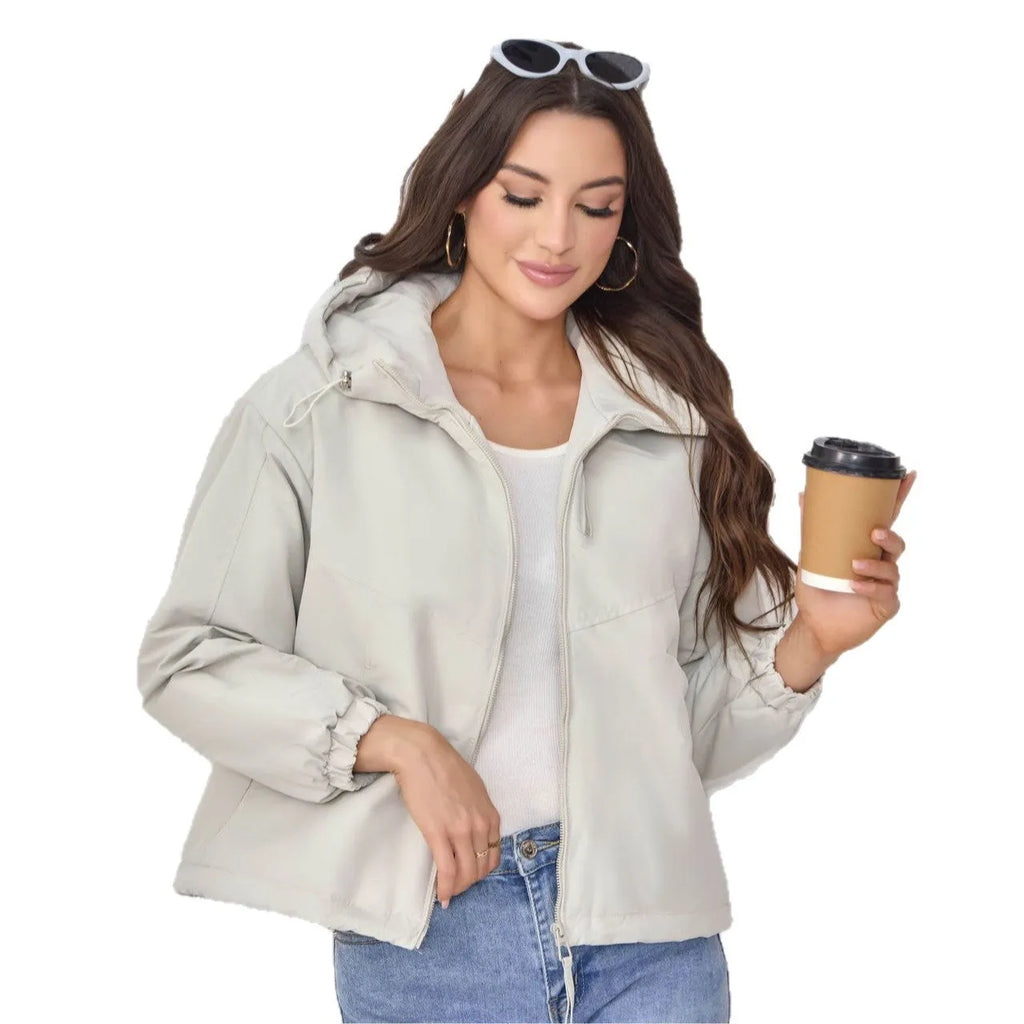 Women's loose-fit hooded shell jacket in grey shown from the front, with long sleeves and a zip front.