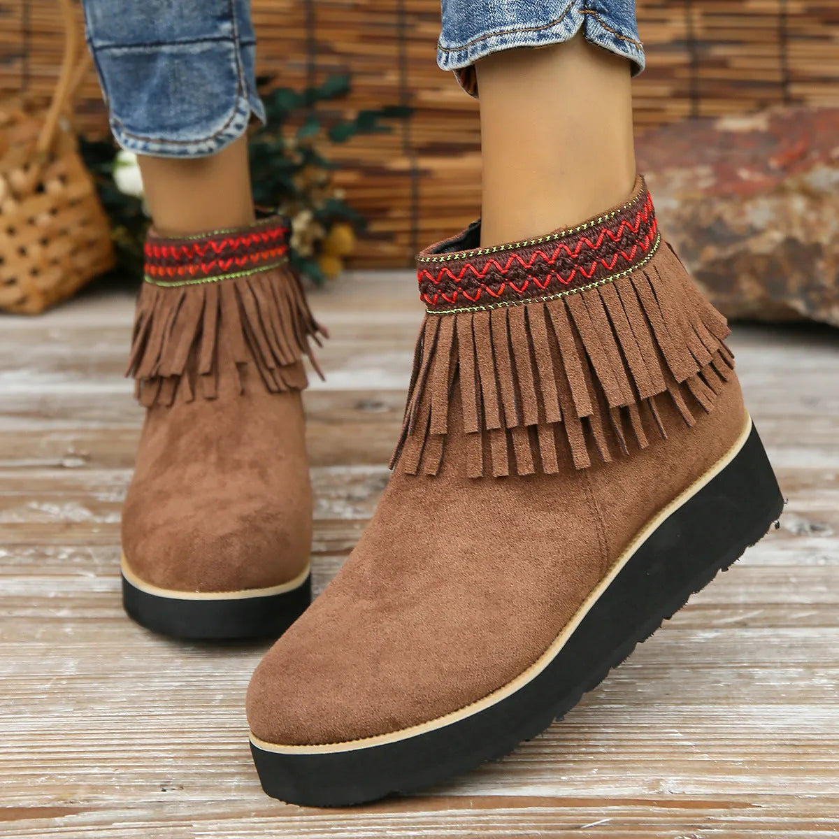 Women's suede wedge bootie in dark brown with side zipper and tassel detail on a 4cm rubber sole