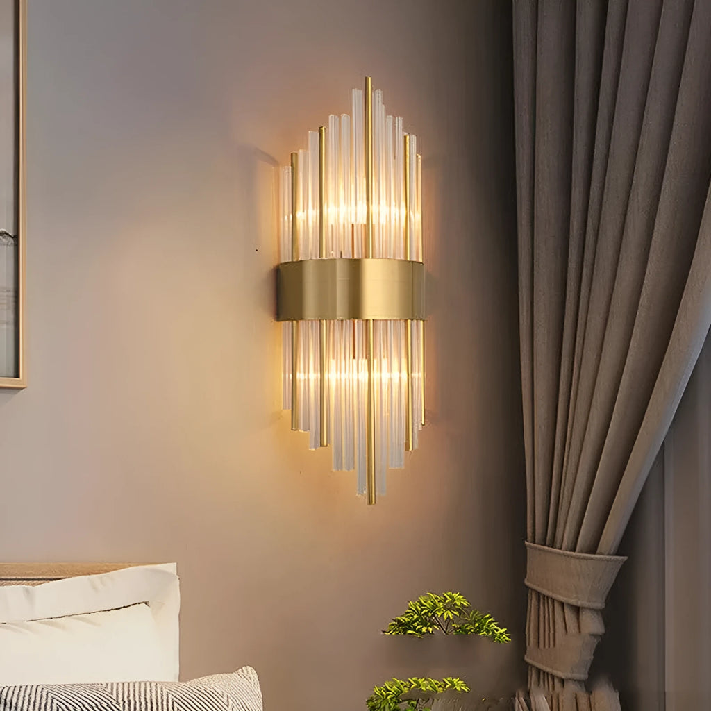 Modern crystal petal wall lamp with metallic gold finish mounted on a light-coloured wall.