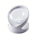 Clear elevated cat food bowl with 15-degree tilt angle on white surface
