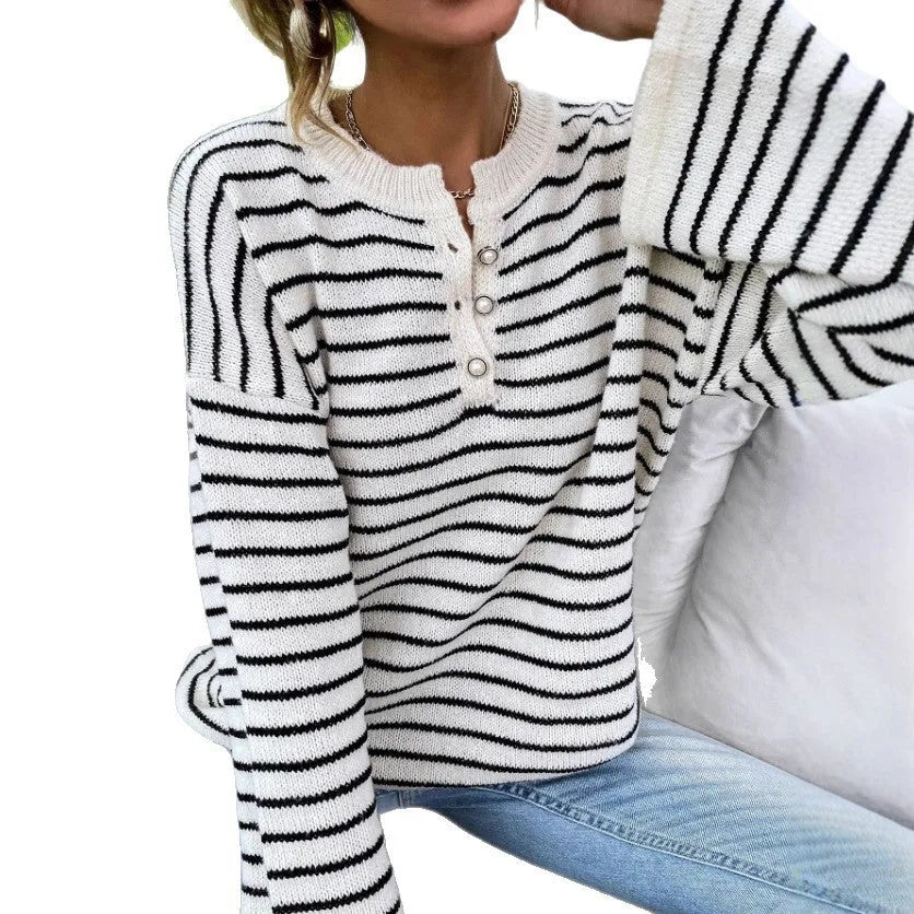 Black and white striped women's long-sleeve viscose top with drop-shoulder sleeves and a button detail.