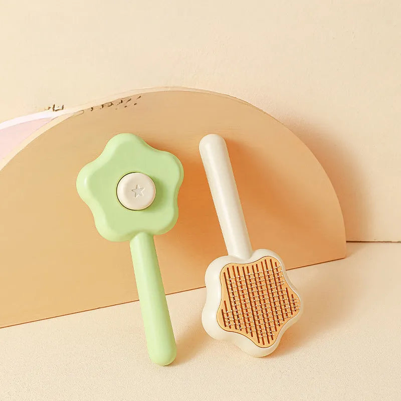 Green cat grooming comb with stainless steel needles and self-cleaning feature, 20cm length