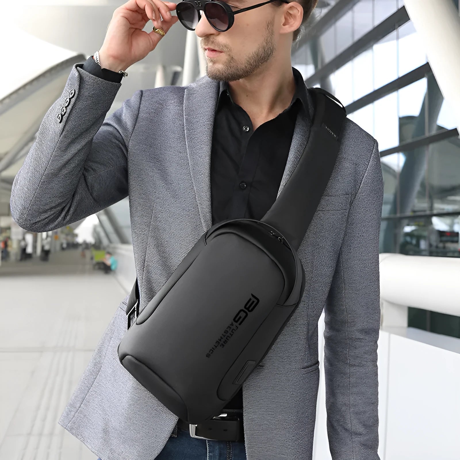 Men's oxford cloth USB shoulder bag for business travel in black colour with letters detailing