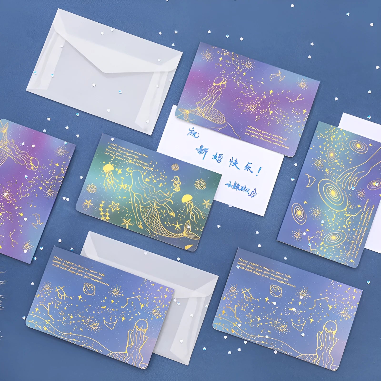 Set of three girly style bronzing mermaid greeting card envelopes on sulfuric acid paper.