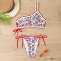 Blue one-shoulder floral bikini set on mannequin showing asymmetrical design and briefs bottom