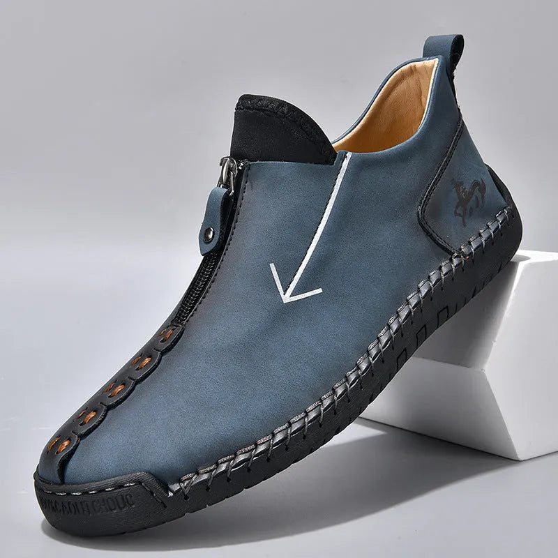 Men's black leather boots with front zipper, hand-stitched sole, and mid-calf length