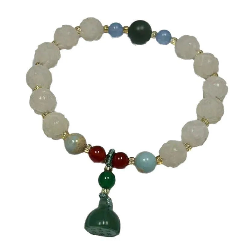 Hand-carved Bodhi root bracelet with White Jade beads, lotus carvings, and a cat's paw pendant.