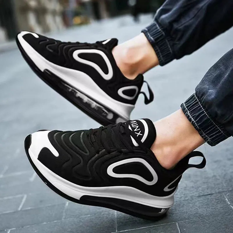 Men's black casual sneakers with a thick sole and lace-up front on a white background.