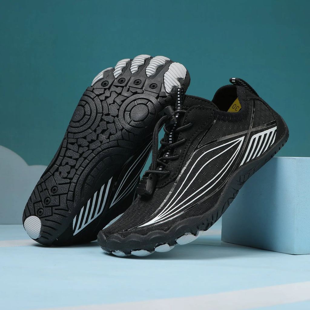 Children's black and grey quick-drying wading shoes with elastic band and rubber sole.