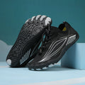 Children's black and grey quick-drying wading shoes with elastic band and rubber sole.