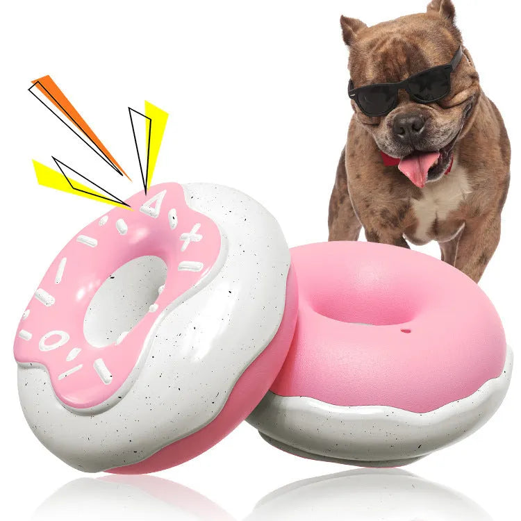 Pink donut-shaped dog toy with textured surface for teeth cleaning, 118mm diameter with squeaker inside
