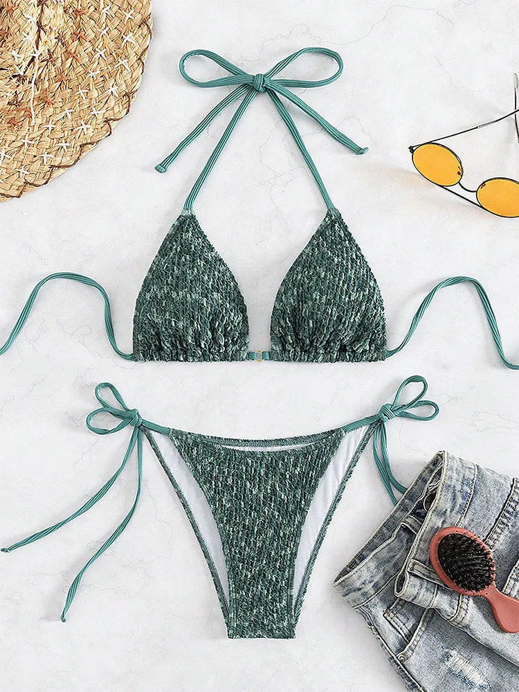 Green women's halter backless swimsuit set with matching shorts