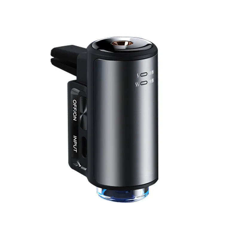 Obsidian black car vent clip aroma diffuser with essential oil bottle on a car air vent.