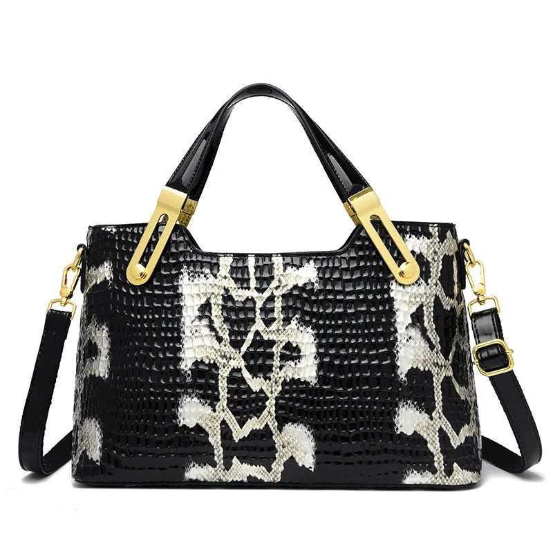 Black retro style messenger bag with chain detail showing internal phone pocket and file compartment