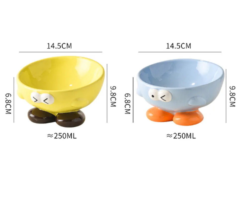 Blue slanted ceramic pet bowl for cats and dogs on a plain background.