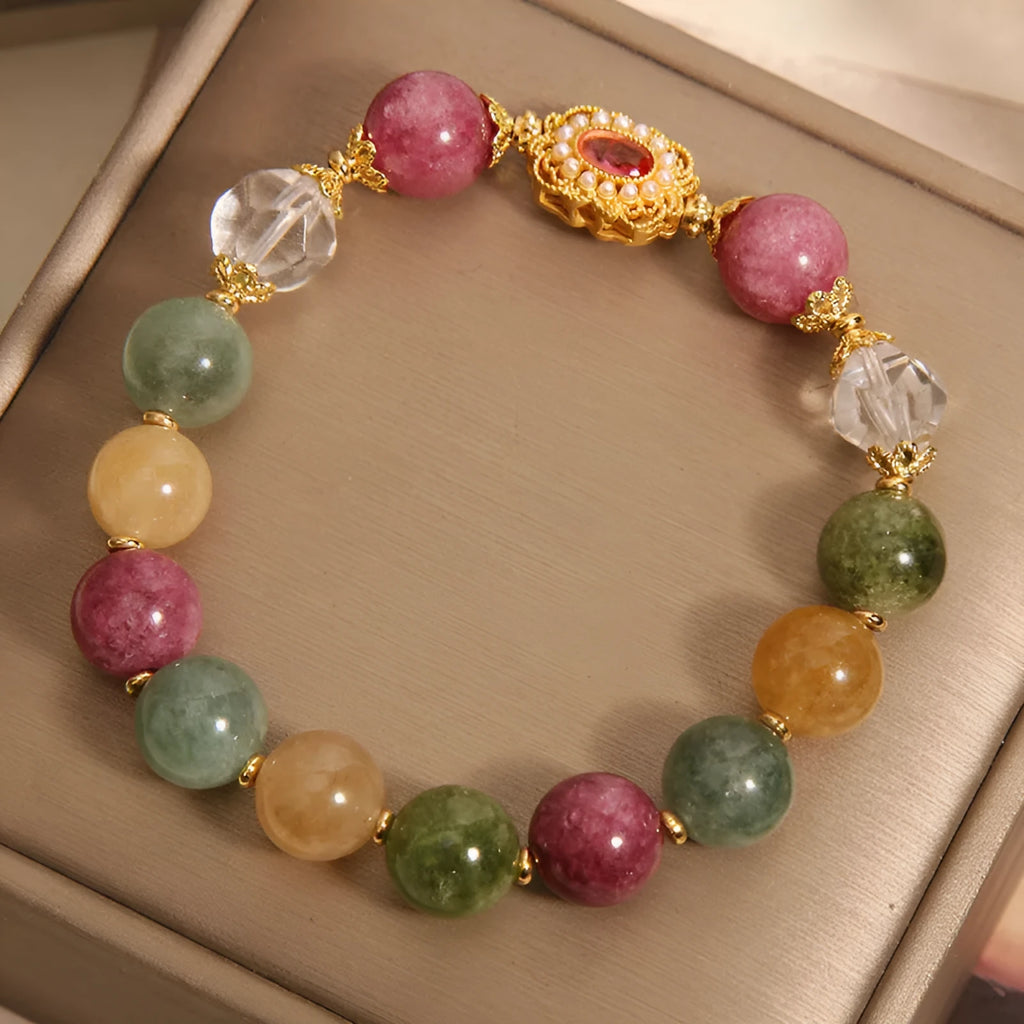 Jade colour tourmaline bracelet for women with alloy setting and rhinestone details on pearl crystal base.