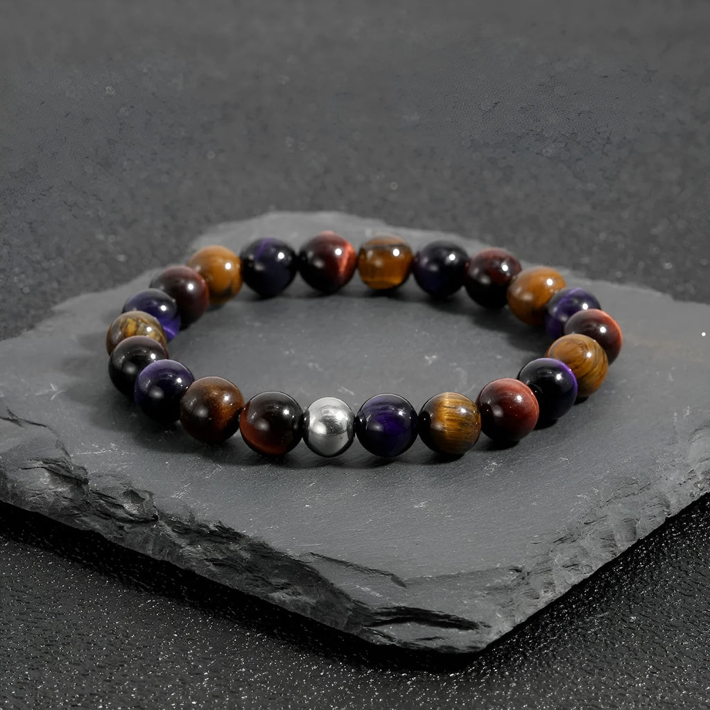 Handmade elastic bracelet with yellow, purple, and red natural tiger-eye stone beads in a geometry shape.