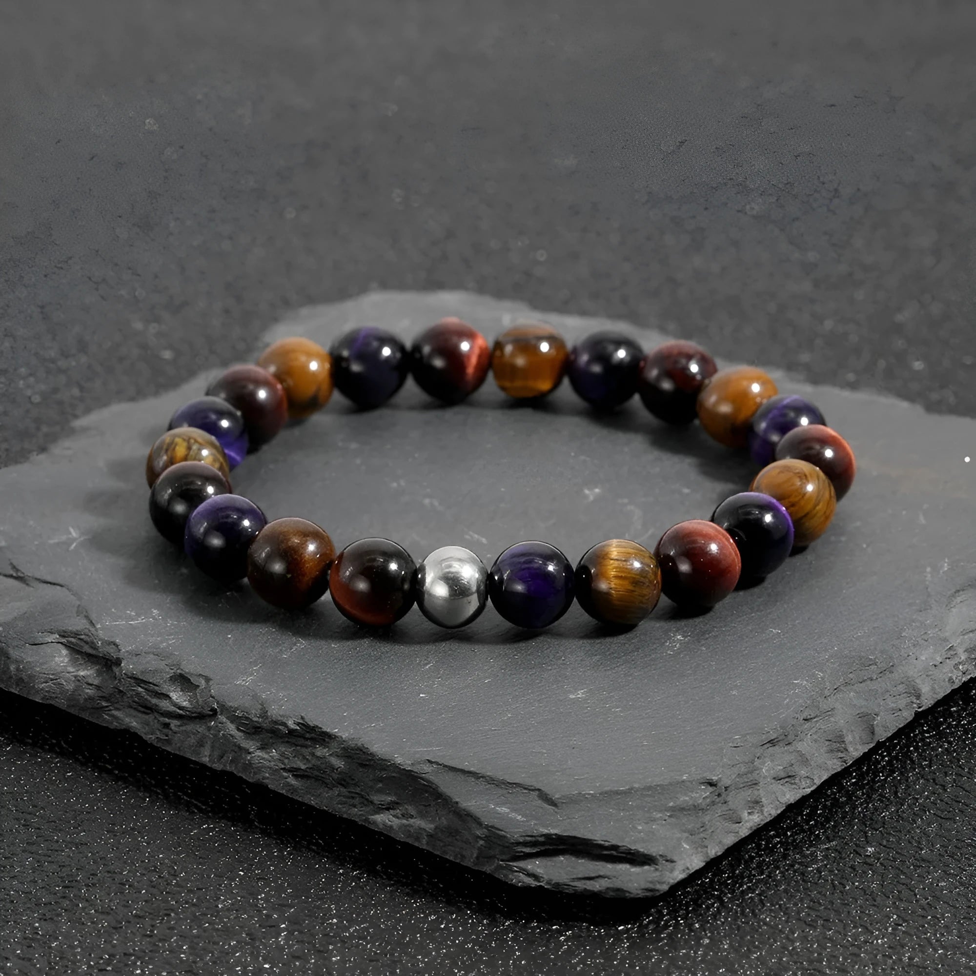 Handmade elastic bracelet with yellow, purple, and red natural tiger-eye stone beads in a geometry shape.