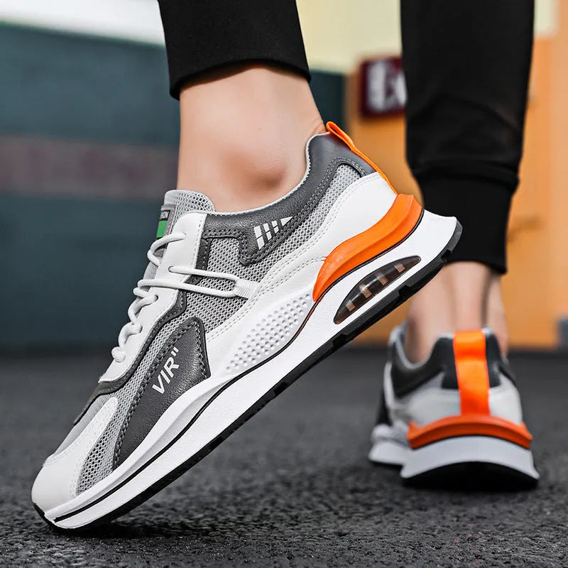 Men's gray breathable mesh running shoes with EVA sole and sewing thread details on upper