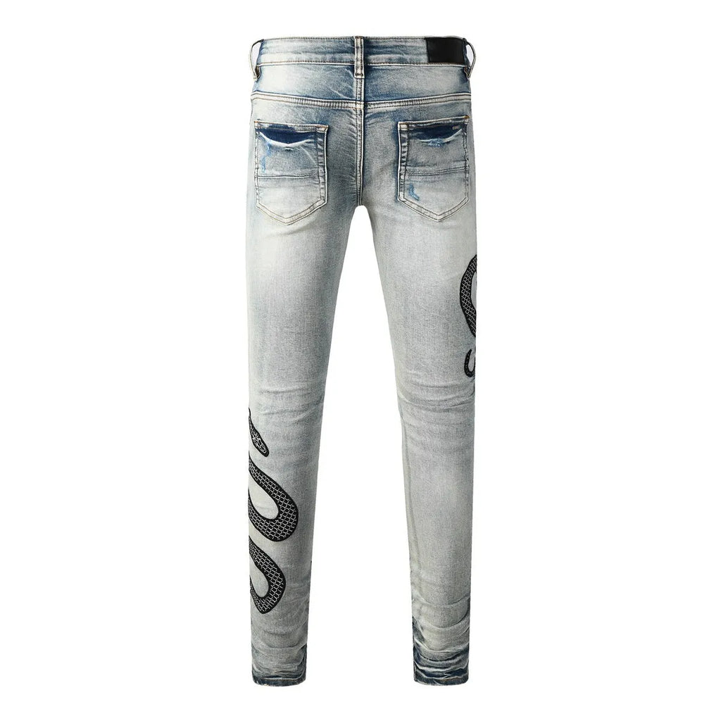 Blue distressed skinny jeans with a button fly on a mid-rise waist.