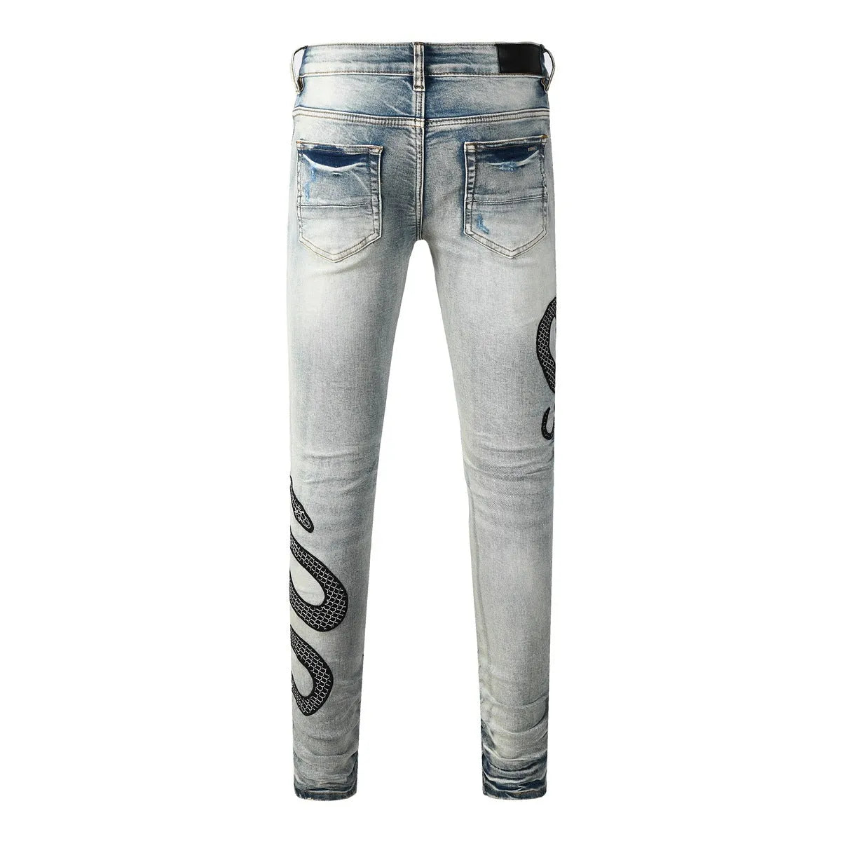 Blue distressed skinny jeans with a button fly on a mid-rise waist.