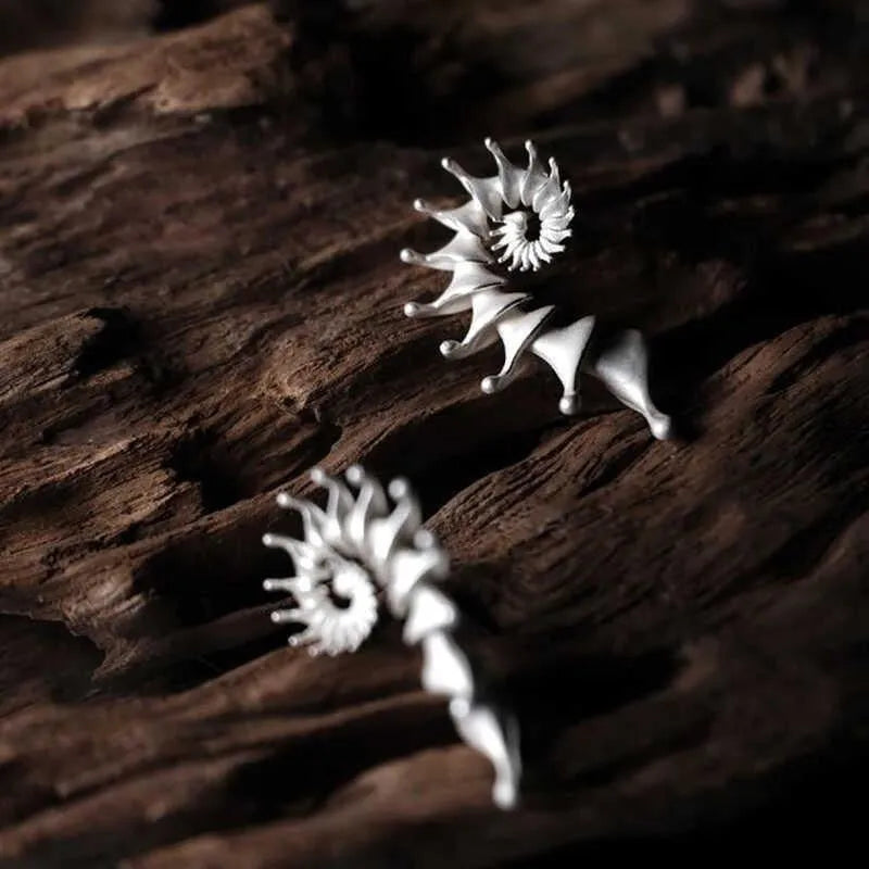 Exaggerated conch three-dimensional matte earrings with irregular shape elements and alloy construction