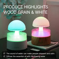 White rain cloud shaped humidifier with rainfall simulation and colour changing night light functions