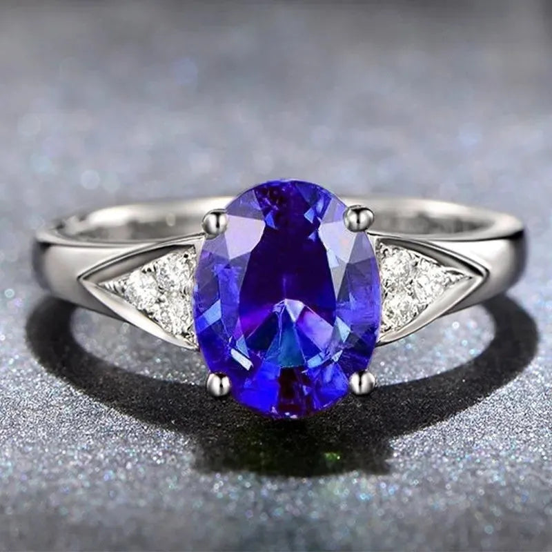 Women's court style ring with natural zircon inlay showing heart, water drop, or bell pattern options in blue, green, light blue, or red