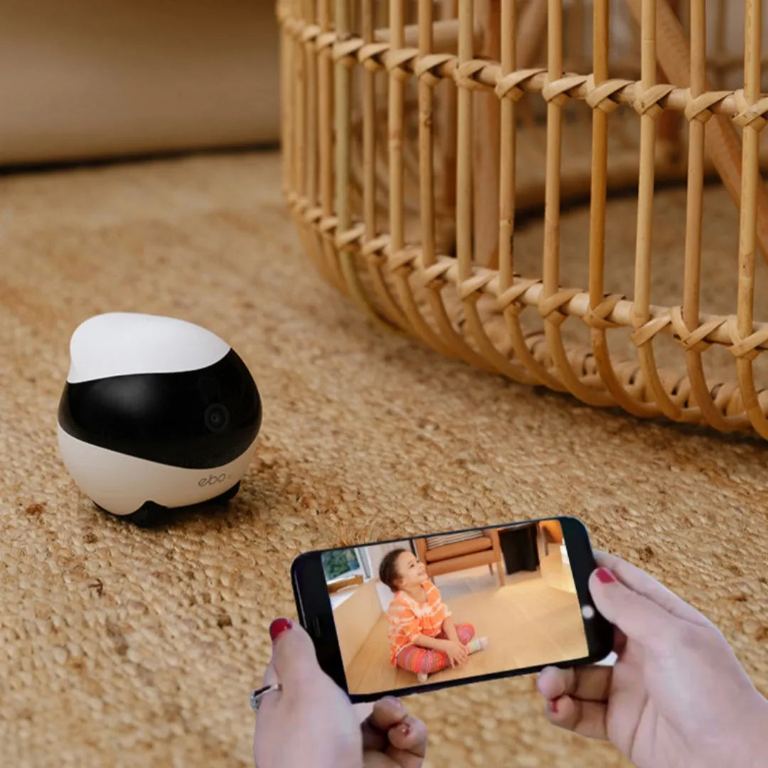 Smart home mobile surveillance robot camera in white with automatic docking station, dimensions 95x94x89mm