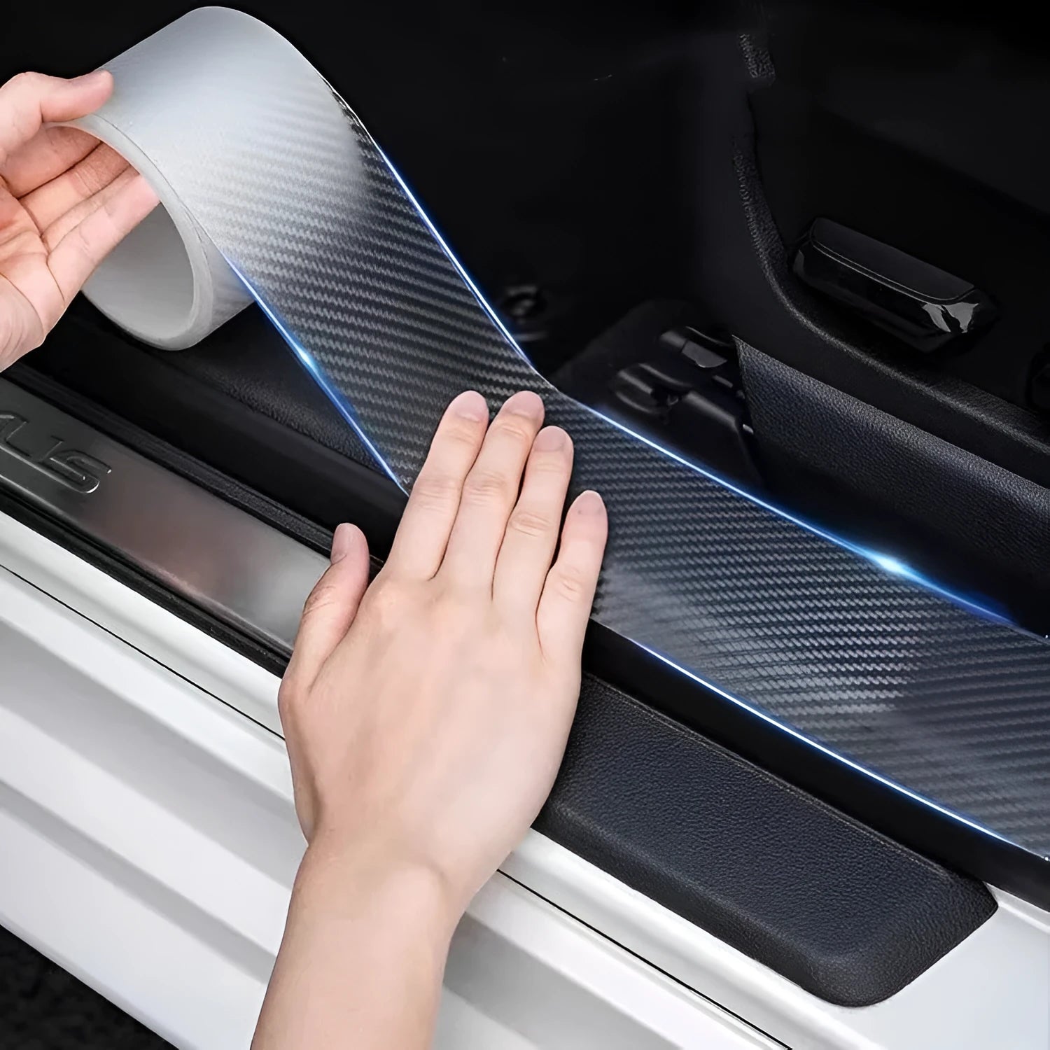 Roll of transparent carbon fibre grain anti-collision strip for car protection with scraper and utility knife.