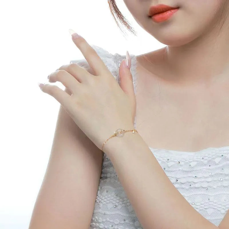 Silver-gold women's bracelet with peace buckle design, white chalcedony stone and starry sky decorations